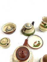 Selection of Cornish ware pottery includes tea pots, bowls, milk jugs etc