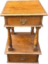 Oak two drawer hall table on casters measures approx 29 inches tall by 17 inches wide and 18