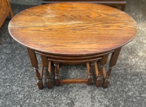 Nest of three oak tables measures approx 21 inches tall by 32 inches wide and 22 inches deep