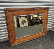 Large framed mirror, measures approximately 34 inches tall 41 inches wide