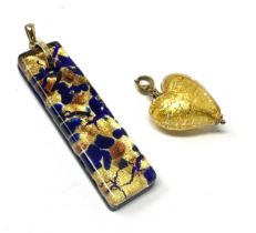 2 x 9ct gold bailed foiled glass pendants (23.1g)