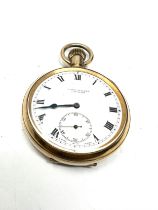 gold plated open face pocket watch the watch is ticking