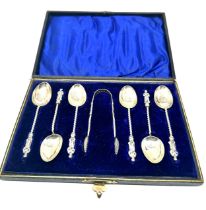 Boxed set of silver apostle teaspoons & sugar tongs