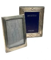 2 silver picture frames largest measures approx 18cm by 14cm