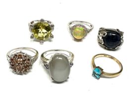 Six silver gemstone set dress rings including opal (28g)