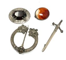 Four silver Scottish revival brooches including a penannular (53g)