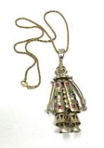 A silver stone set articulated clown pendant and chain (35g)