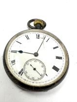 silver open face pocket watch the watch is ticking