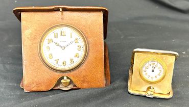 Leather cased traveling clock, silver cased travelling clock