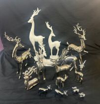 Selection of wooden, pot and metal reindeer and stag Christmas ornaments, tallest measures