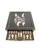 Oriental cased wooden chess set measures approximately 17 inches by 17 inches