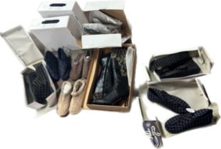 Large selection of assorted shoes, boots and slippers assorted styles and sizes