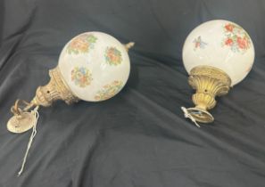 A pair of globe wall hanging light fittings