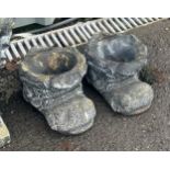 A pair of concrete boot planters measures approximately 5 inches tall by 7 inches diameter