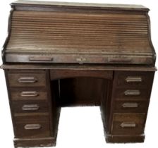 Antique oak twin pedastool roll top desk measures approximately 47 inches tall 48 inches wide 27.5
