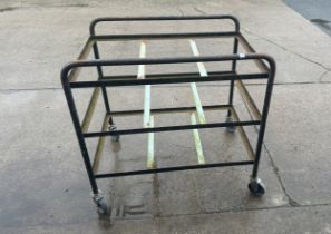 Industrial Trolley measures approx 34 inches tall byy 34 inches wide and 24 inches deep