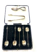 Selection of Silver pieces to include 5 cocktail spoons, sugar tongs, tea caddy spoon all