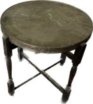 Vintage brass topped folding games table measures approximately 25 inches tall 24 inches diameter