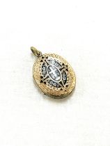 Antique Victorian gold front and back enamel mourning locket. Size not including top loop 3 cm x 2.2