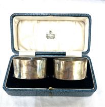 Cased silver hallmarked napkin rings, total silver weight 87.5g