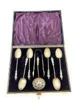Cased set of hallmarked silver Apostle teaspoons and tongs, total weight 65.8g