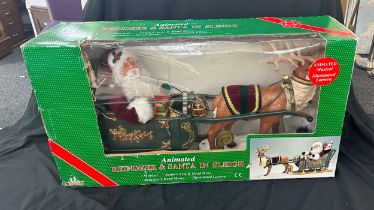 Boxed Animated reindeer and Santa in sleigh, musical ornament, Santas head and arm move, reindeer'