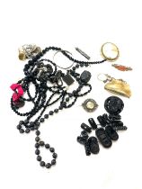 Antique Victorian jet mourning jewellery, cameo, small purse, nanny pin, rabbits foot etc