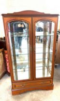 Mahogany two door one drawer display cabinet measures approx 60 inches tall, 32 wide and 13 deep