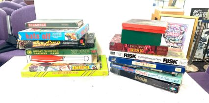 Large selection of assorted games includes risk, scrabble, web of gold, spy ring etc