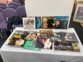 Large selection of assorted records includes elvis, Johnny cash, Abba etc