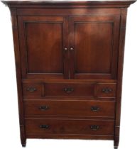 Two door 5 drawer cherry wood unit measures approx 58 inches tall by 44.5 inches wide and 25
