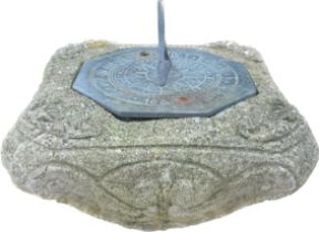 Octagonal 1661 sundial encased with a concrete base, approximate overall measurements 9 x 9