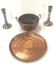 Selection of copper and brass ware to include a pair of candlesticks, a tray and bowl
