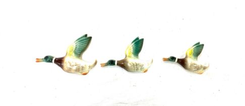 Set of three porcelain wall hanging ducks largest measures approx 7.5 inches wide