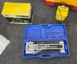 Selection of tools includes tile cutter, tramsformer etc