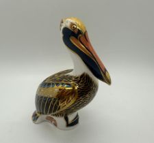 A Royal Crown Derby paperweight, Brown Pelican, 13cm high, gold stopper and red Royal Crown Derby