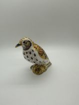 A Royal Crown Derby paperweight, Song Thrush, 11cm high, gold stopper, red printed marks and Royal