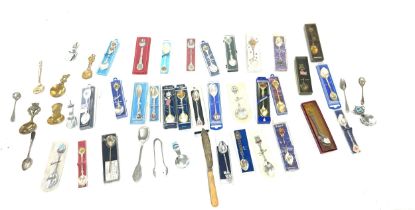 Large selection of souvenir spoons