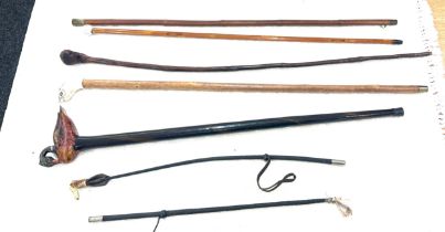 Selection of vintage walking sticks to include ones with novelty animal handles and horse whips