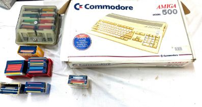 Boxed Commodore Amiga 500 with a large selection of disc games, in original box, untested