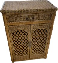 1 drawer 2 door wicker cabinet measures approximately 34 inches tall 24 inches wide 14 inches depth