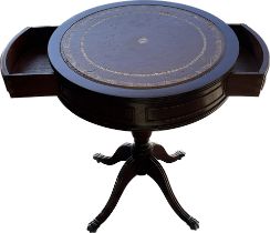 Leather topped drum table on casters measures approximately 24 inches tall 20 inches diameter