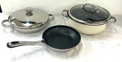 Three pieces of brand new Cooks essentials stainless steel non stick cookware pans