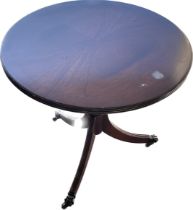 Vintage occasional table on casters measures approximately 20.5 inches tall 20 inches diameter