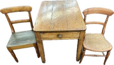 One drawer pine table and two chairs- table measures approx 29 inches tall by 36 inches wide and