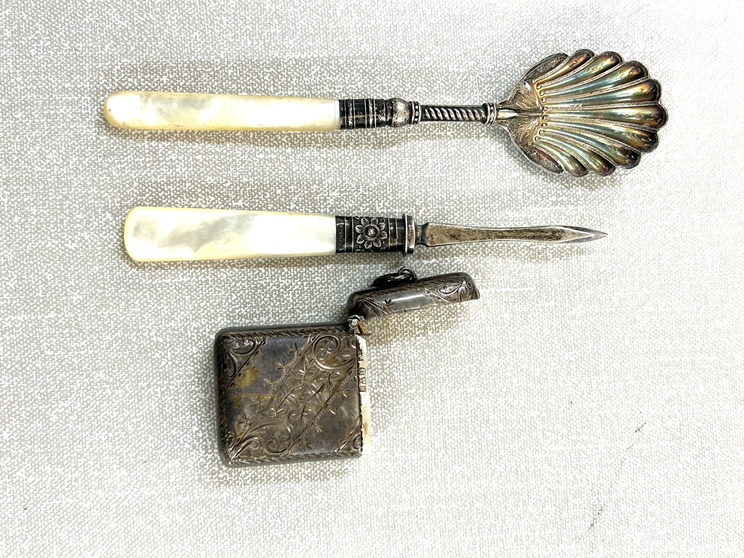 Selection of silver items includes vesta case chester 1907, sheffield silver spoon and manicure