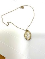 9ct gold oval locket on a 9ct gold chain total weight 6.7grams