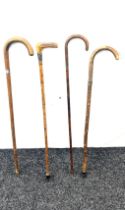 Selection of 4 vintage walking sticks, with silver rims