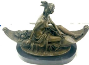 Duchoiselle, a bronze study of a Native American woman in canoe, with impressed mark, on marble