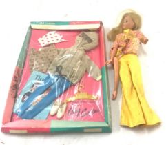 Vintage 1966 matell doll and a Tina Cassini outfit, damaged to doll